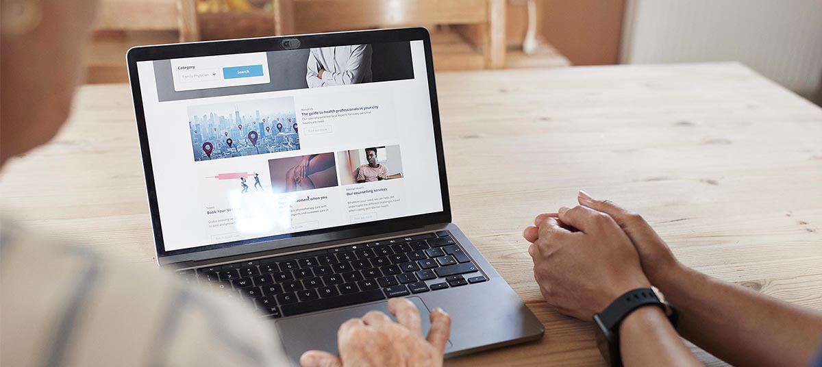 People browsing a website on a laptop