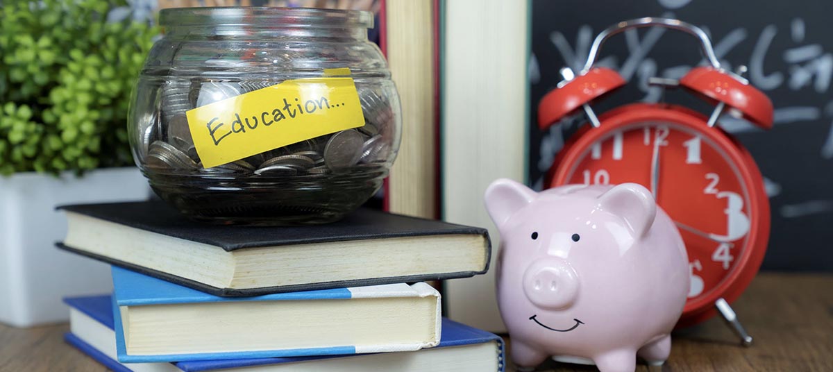 Saving for education with coins and books