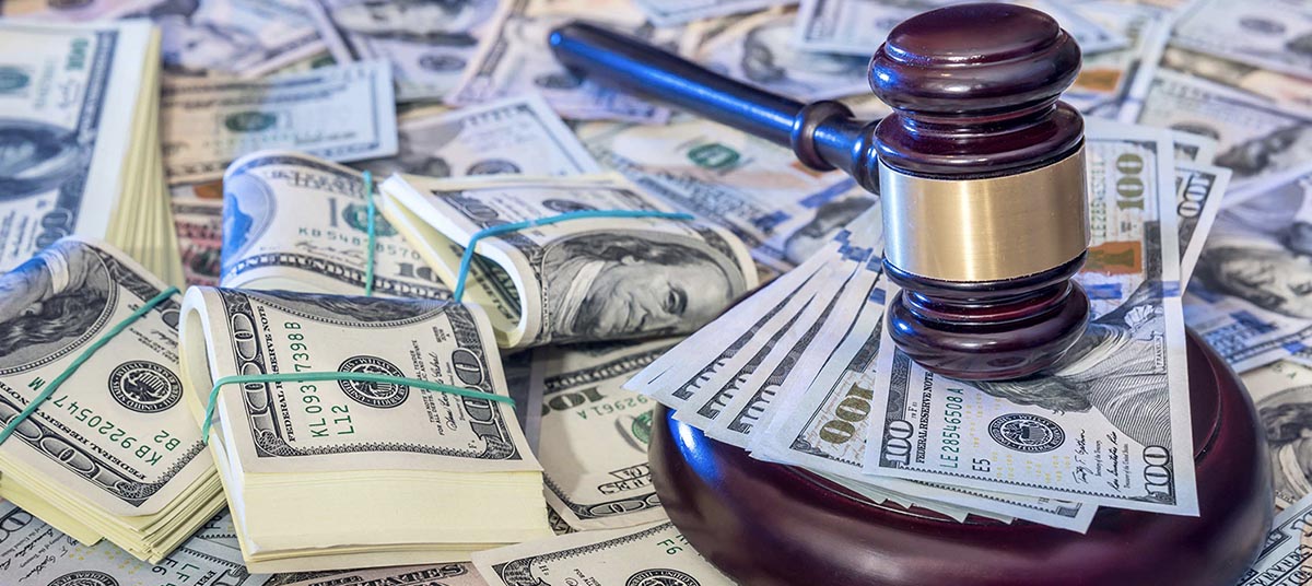 Money and justice symbolized by gavel and cash