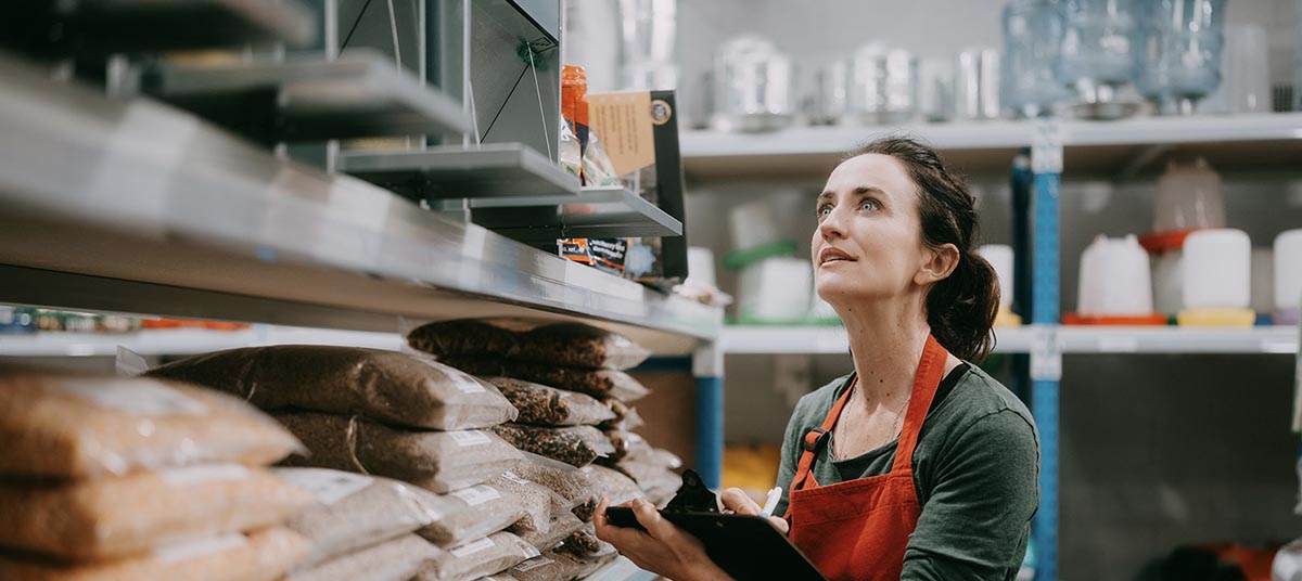 Woman organizing shelves in a store