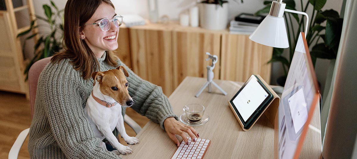 Woman and dog in home office
