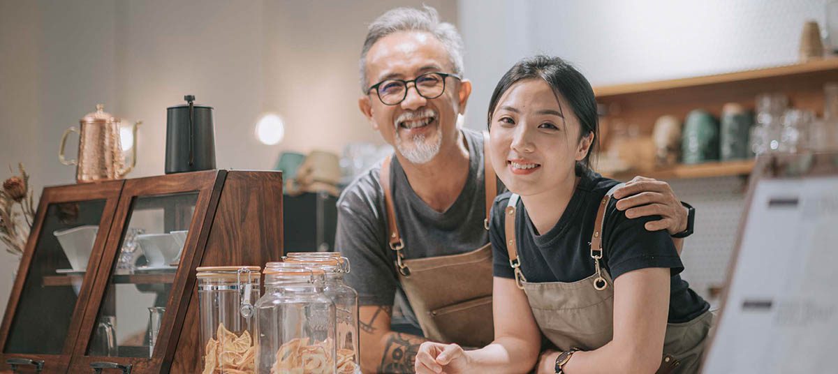 Baristas posing behind the counter