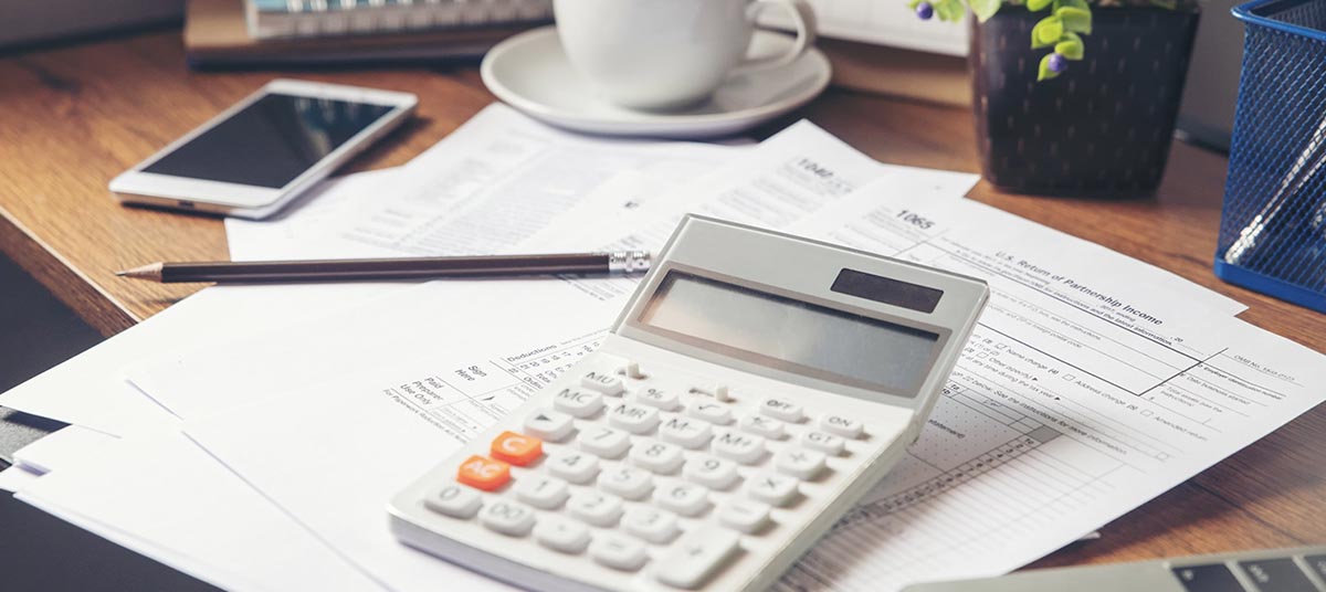 Workspace with coffee and financial documents