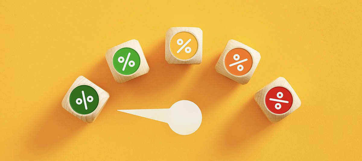 Colorful percentage cubes on a yellow background.