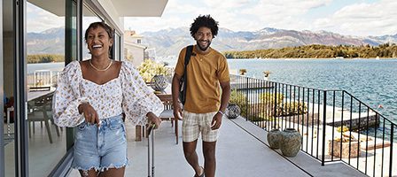 Happy travelers on a scenic balcony
