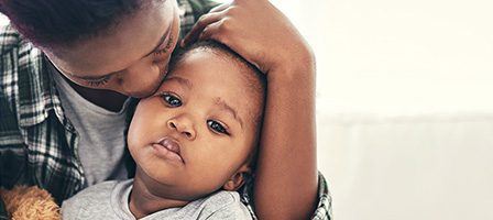 Loving hug between parent and child