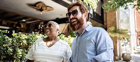 Smiling couple enjoying outdoor cafe