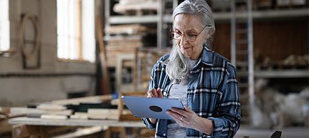 Woman using tablet in a workshop