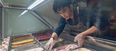 Man working at ice cream counter