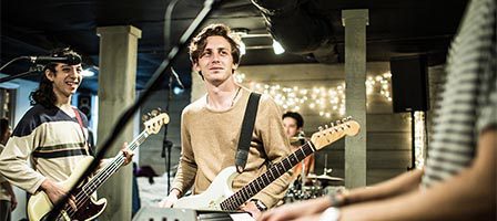 Musicians jamming with guitars and keyboard