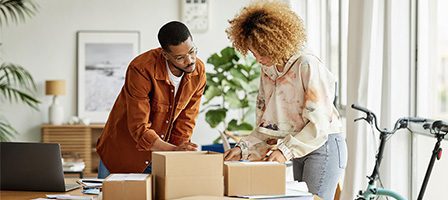 People organizing packages at home