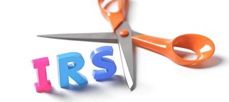 IRS letters with scissors background