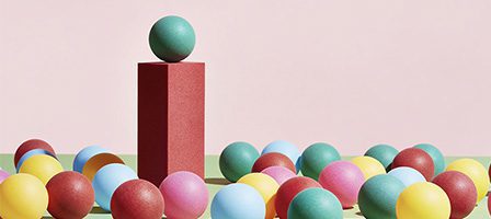 Colorful spheres on pastel background