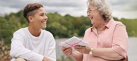 Happy conversation between two women outdoors