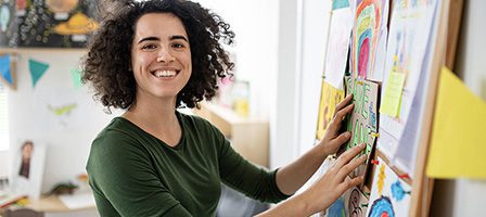 Happy individual decorating a creative display