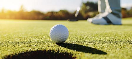 Close-up of golf ball on course