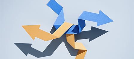 Paper arrows casting shadows
