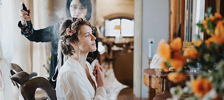 Wedding preparation with stylist and bride
