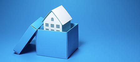 Blue box with small house model