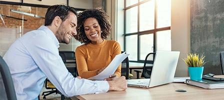 Coworkers working together in modern workspace