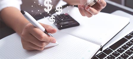 Money management concept with pen and notebook