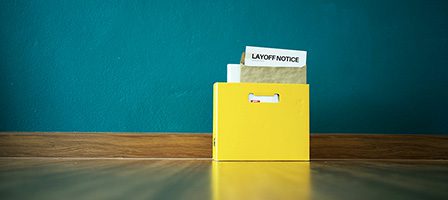 Yellow box with layoff notice
