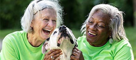 Two women and dog, outdoor happiness