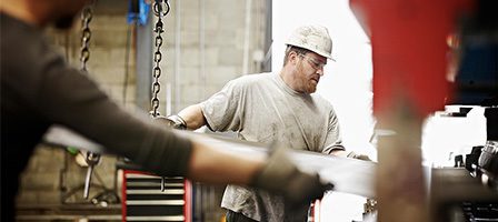 Industrial worker operating machinery in factory