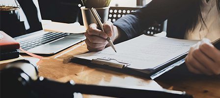 Office worker reviewing documents and notes