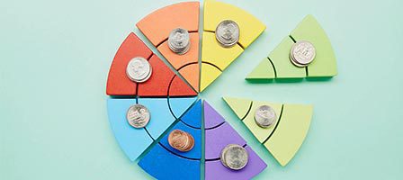 Financial pie chart on pastel background