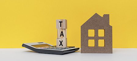 Calculator with tax blocks and house model