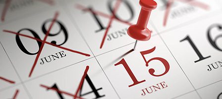 Calendar with red pin on June 15