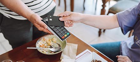 Contactless payment at a restaurant table
