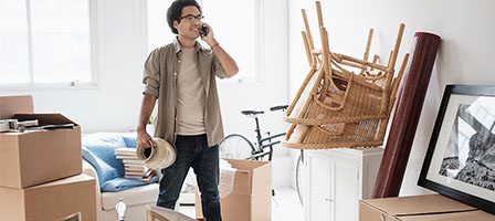 Person organizing boxes in new home