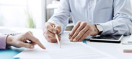 Reviewing documents together at a desk