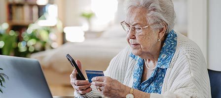 Woman banking online at home