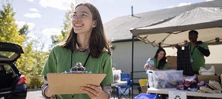 Smiling woman at community donation drive