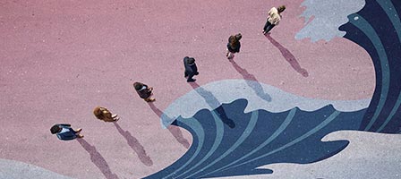 People walking on colorful wave mural