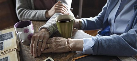 Two people sharing coffee and memories