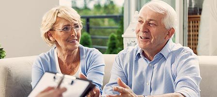 Happy seniors meeting with consultant