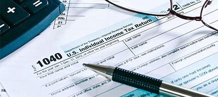 Income tax preparation materials on desk