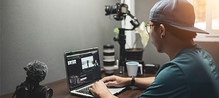 Filmmaker using computer for editing