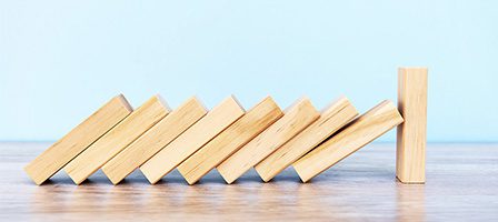 Wooden dominoes in a line